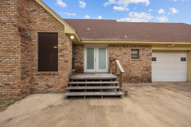 410 S Walnut Grove Rd, Midlothian, TX 76065 - doorway to property with brick siding, french doors, a shingled roof, and an attached garage