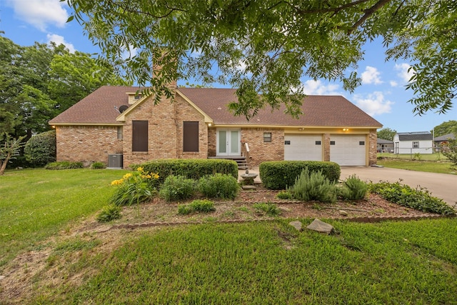 410 S Walnut Grove Rd, Midlothian, TX 76065 - view of front of home featuring french doors, brick siding, a front yard, and concrete driveway