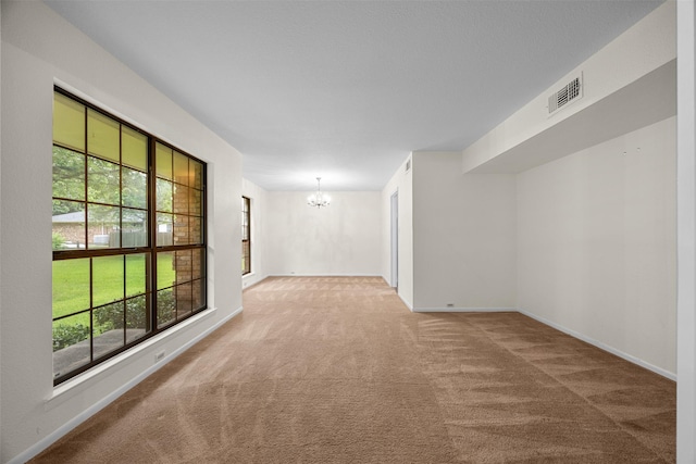 410 S Walnut Grove Rd, Midlothian, TX 76065 - carpeted spare room featuring a chandelier and baseboards