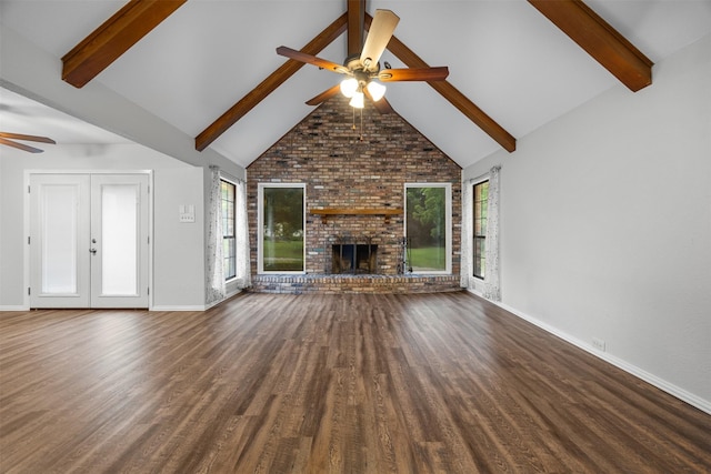 410 S Walnut Grove Rd, Midlothian, TX 76065 - unfurnished living room featuring ceiling fan, baseboards, beamed ceiling, a fireplace, and wood finished floors
