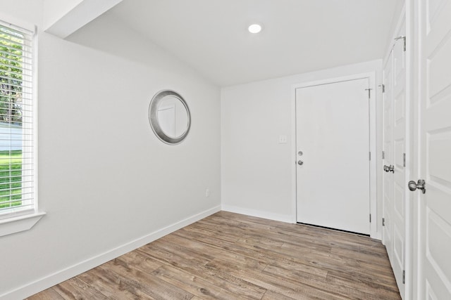1005 W Bullock St, Denison, TX 75020 - unfurnished room with wood finished floors, baseboards, and recessed lighting
