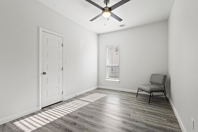 1005 W Bullock St, Denison, TX 75020 - unfurnished room featuring a ceiling fan, wood finished floors, and baseboards