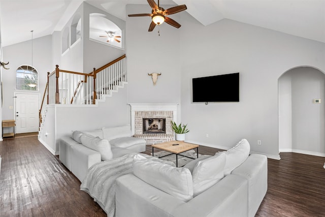 405 High Desert Dr, Fort Worth, TX 76131 - living room with ceiling fan, high vaulted ceiling, dark wood-style flooring, arched walkways, and stairs