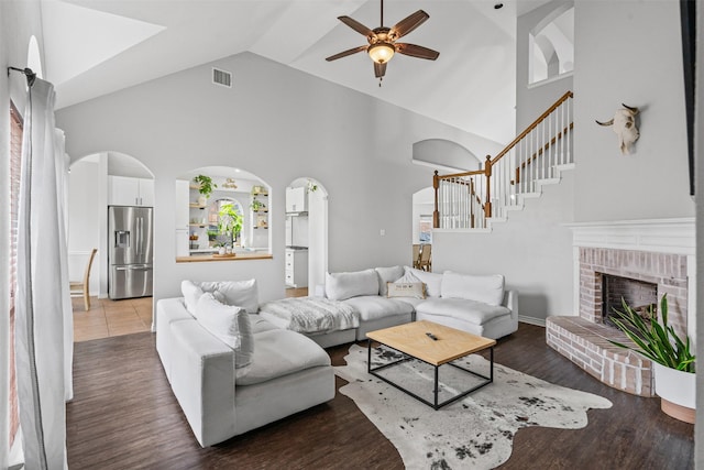 405 High Desert Dr, Fort Worth, TX 76131 - living room with ceiling fan, stairs, arched walkways, high vaulted ceiling, and wood finished floors