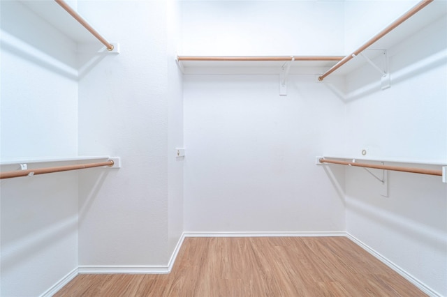 1311 Heather Brook Dr, Allen, TX 75002 - spacious closet featuring wood finished floors
