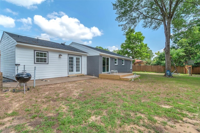 312 Dean St, Athens, TX 75751 - back of house featuring french doors, a wooden deck, and a patio