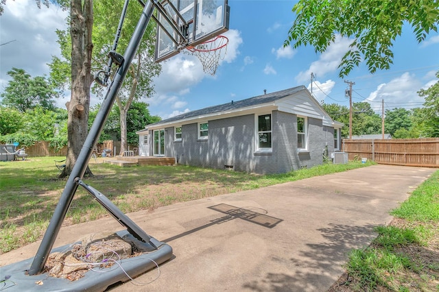 312 Dean St, Athens, TX 75751 - rear view of property with central AC, brick siding, and crawl space