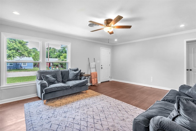 312 Dean St, Athens, TX 75751 - living room featuring ceiling fan, dark wood-type flooring, baseboards, crown molding, and recessed lighting