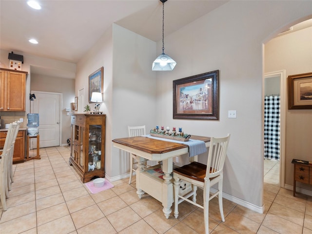 1533 Melanie Trl, Midlothian, TX 76065 - dining room featuring arched walkways, light tile patterned floors, recessed lighting, and baseboards