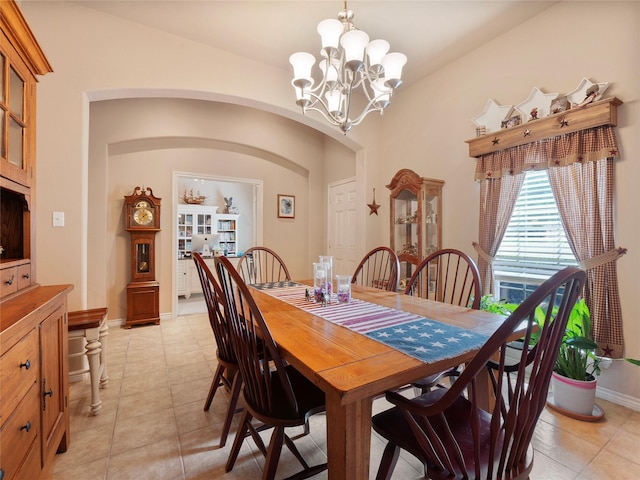1533 Melanie Trl, Midlothian, TX 76065 - dining space with a chandelier, arched walkways, and light tile patterned floors