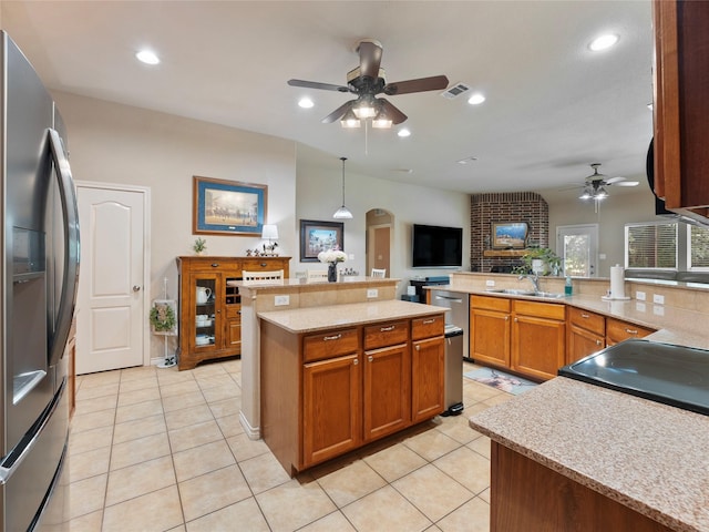1533 Melanie Trl, Midlothian, TX 76065 - kitchen with stainless steel fridge, a ceiling fan, arched walkways, a sink, and light tile patterned flooring