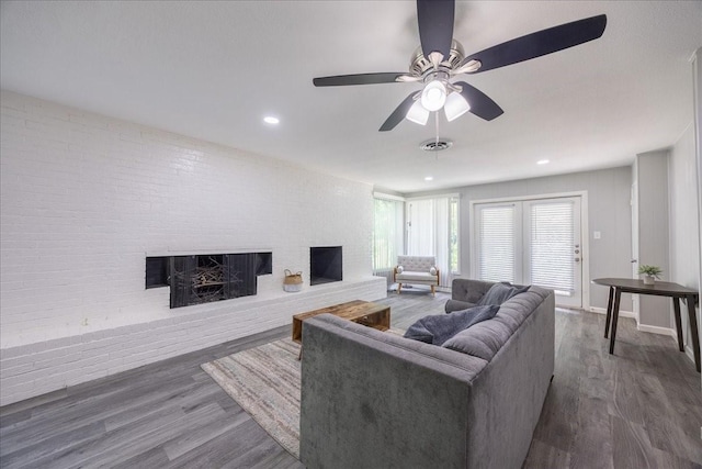 5401 Odom Ave, Fort Worth, TX 76114 - living room featuring a brick fireplace, wood finished floors, ceiling fan, recessed lighting, and brick wall
