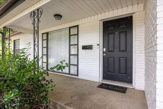 5401 Odom Ave, Fort Worth, TX 76114 - doorway to property featuring brick siding and a porch