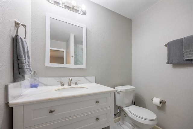 5401 Odom Ave, Fort Worth, TX 76114 - bathroom featuring toilet, vanity, and baseboards