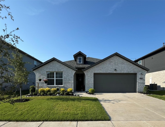 608 N Rain Barrel Pl, Weston, TX 75009 - french provincial home with a front lawn, an attached garage, concrete driveway, brick siding, and central AC