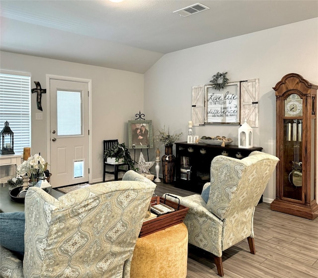 608 N Rain Barrel Pl, Weston, TX 75009 - living area featuring wood finished floors, lofted ceiling, and baseboards