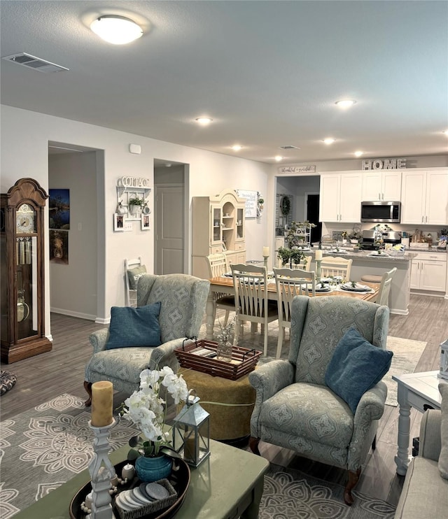 608 N Rain Barrel Pl, Weston, TX 75009 - living area featuring light wood-style floors, baseboards, and recessed lighting