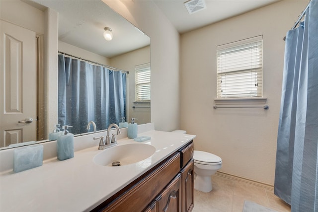1322 Turnbridge Dr, Glenn Heights, TX 75154 - full bathroom with vanity, toilet, tile patterned flooring, and baseboards