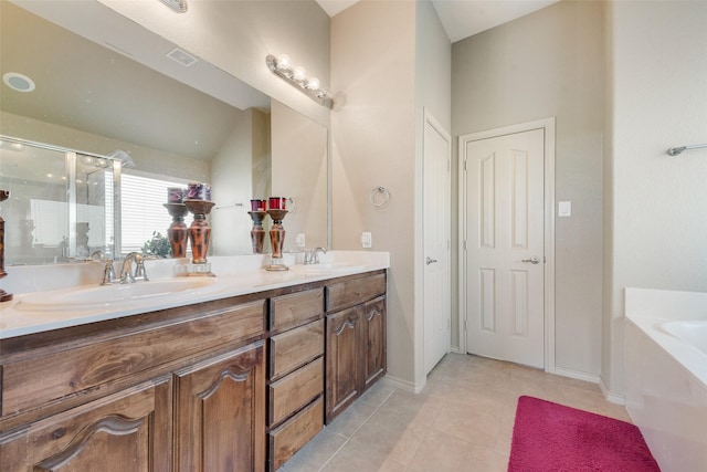 1322 Turnbridge Dr, Glenn Heights, TX 75154 - full bathroom featuring a garden tub, double vanity, tile patterned flooring, a stall shower, and baseboards
