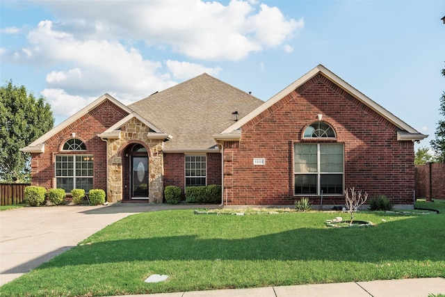 1322 Turnbridge Dr, Glenn Heights, TX 75154 - view of front of home featuring brick siding and roof with shingles