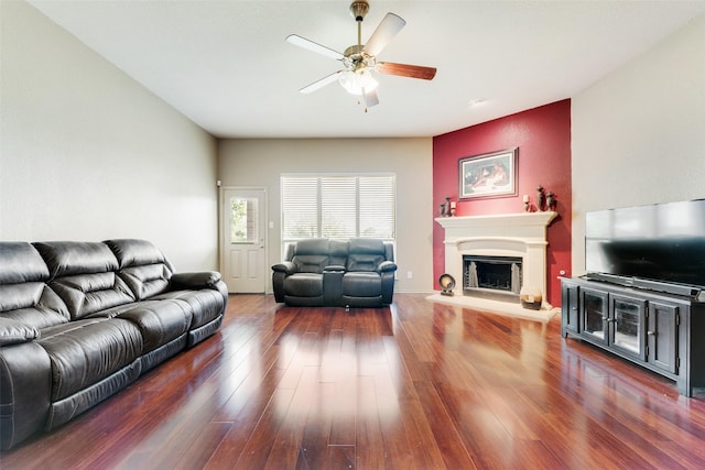 1322 Turnbridge Dr, Glenn Heights, TX 75154 - living area featuring a ceiling fan, wood finished floors, and a fireplace with raised hearth
