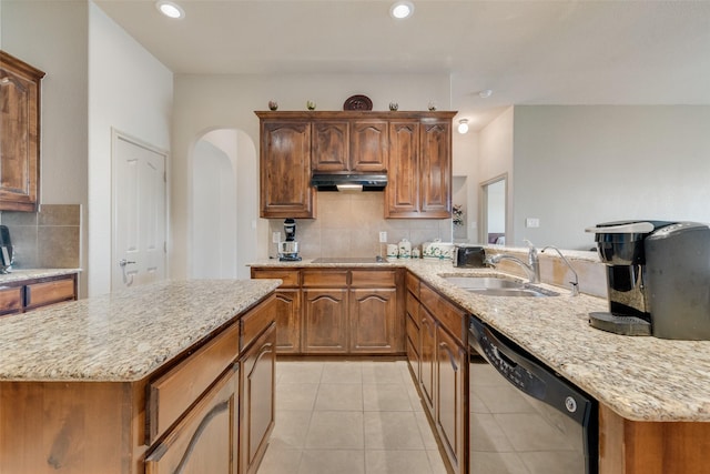 1322 Turnbridge Dr, Glenn Heights, TX 75154 - kitchen featuring dishwashing machine, a sink, under cabinet range hood, decorative backsplash, and black electric cooktop