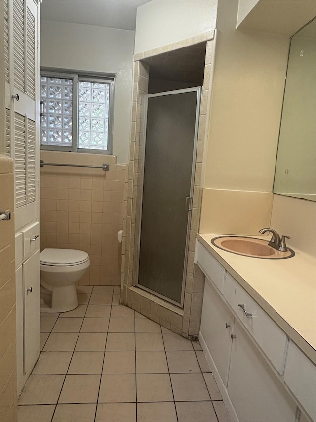 104 W Cayuga Dr, Athens, TX 75751 - full bath featuring tile patterned flooring, vanity, a stall shower, and tile walls