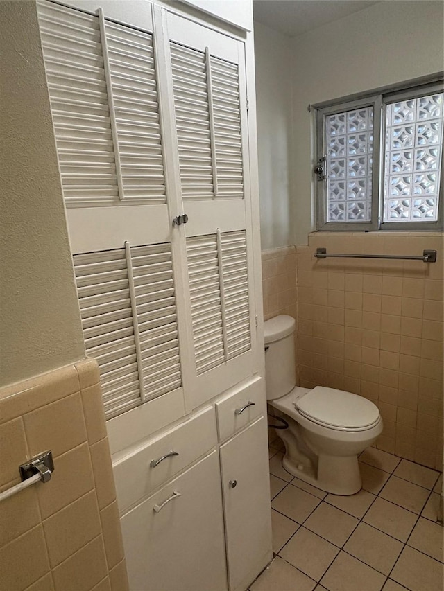 104 W Cayuga Dr, Athens, TX 75751 - bathroom with tile walls, tile patterned floors, and a wainscoted wall