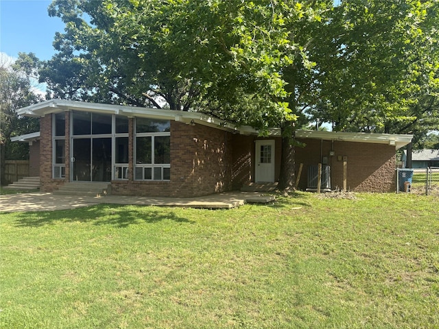 104 W Cayuga Dr, Athens, TX 75751 - rear view of house with brick siding and entry steps