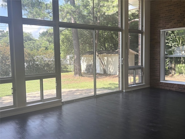 104 W Cayuga Dr, Athens, TX 75751 - entryway with healthy amount of natural light, wood finished floors, and brick wall