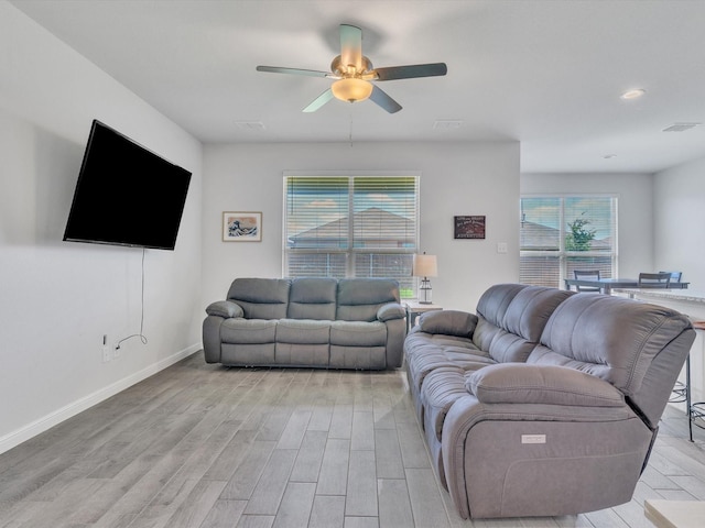 133 Hollytree Ln, Boyd, TX 76023 - living room with ceiling fan, healthy amount of natural light, light wood-style flooring, and baseboards