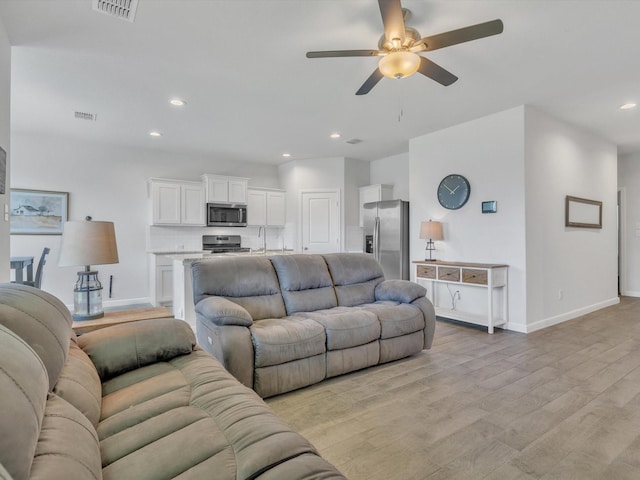 133 Hollytree Ln, Boyd, TX 76023 - living area featuring a ceiling fan, light wood-style flooring, baseboards, and recessed lighting