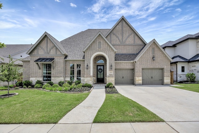 13445 Meadow Cross Dr, Fort Worth, TX 76008 - english style home featuring brick siding, driveway, a front lawn, a shingled roof, and an attached garage