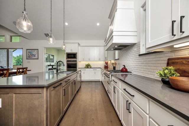 13445 Meadow Cross Dr, Fort Worth, TX 76008 - kitchen with stainless steel appliances, custom exhaust hood, dark countertops, tasteful backsplash, and dark wood finished floors