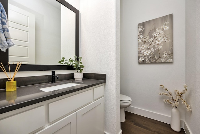 13445 Meadow Cross Dr, Fort Worth, TX 76008 - half bath featuring vanity and wood finished floors