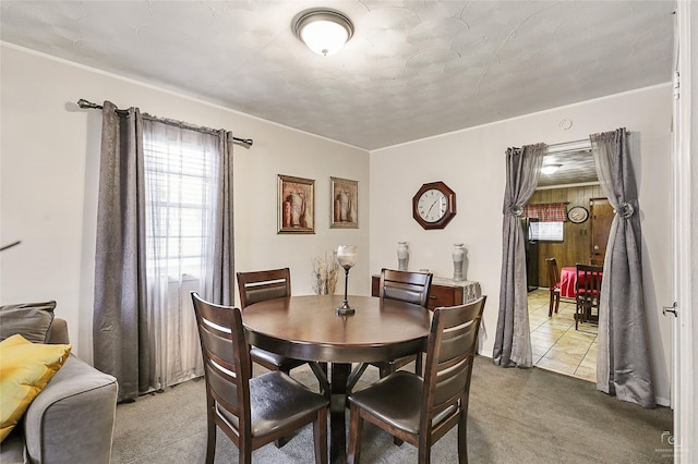 2825 Warren Ave, Dallas, TX 75215 - dining room with healthy amount of natural light and carpet