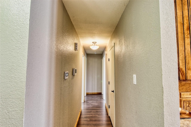 1214 Vivienne St, Weatherford, TX 76086 - corridor with a textured wall and dark wood finished floors
