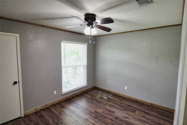1214 Vivienne St, Weatherford, TX 76086 - spare room featuring crown molding, dark wood-style flooring, ceiling fan, a textured ceiling, and a textured wall