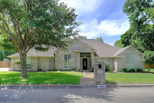 3606 Four Trees Dr, Weatherford, TX 76087 - french country style house with brick siding and roof with shingles