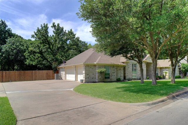 3606 Four Trees Dr, Weatherford, TX 76087 - view of front of house with an attached garage, concrete driveway, and brick siding