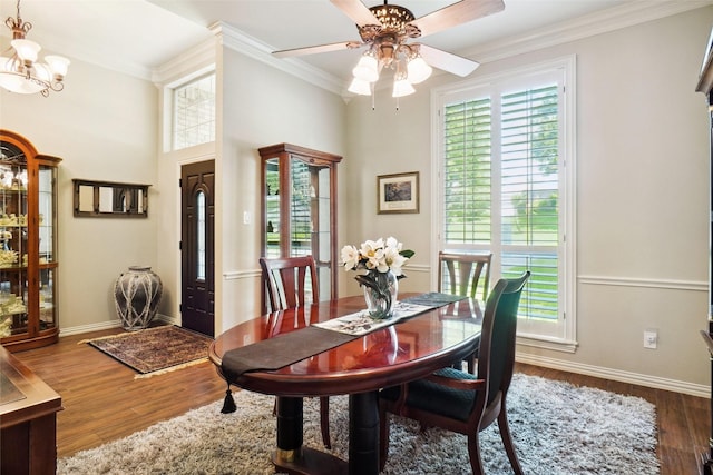 3606 Four Trees Dr, Weatherford, TX 76087 - dining space featuring ornamental molding, a chandelier, a ceiling fan, wood finished floors, and baseboards