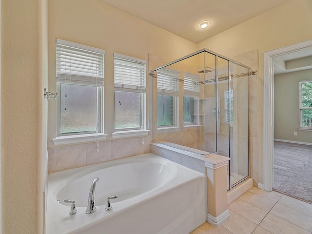 3321 Glen Crest Ln, Denton, TX 76208 - full bathroom featuring a garden tub, tile patterned flooring, a stall shower, and baseboards
