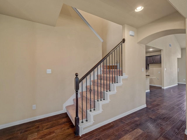 3321 Glen Crest Ln, Denton, TX 76208 - stairway featuring arched walkways, hardwood / wood-style floors, baseboards, and recessed lighting