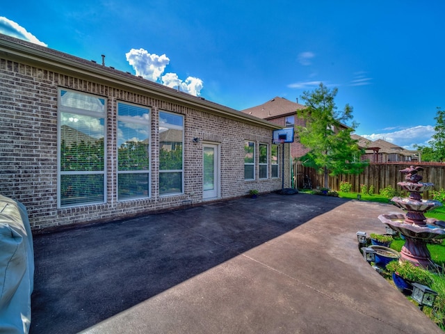 3321 Glen Crest Ln, Denton, TX 76208 - view of property exterior featuring a patio and brick siding