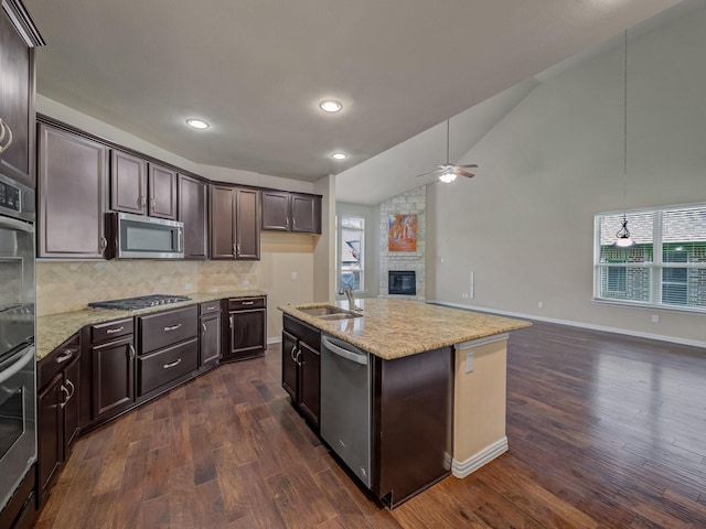 3321 Glen Crest Ln, Denton, TX 76208 - kitchen with appliances with stainless steel finishes, a sink, open floor plan, ceiling fan, and dark wood-style flooring