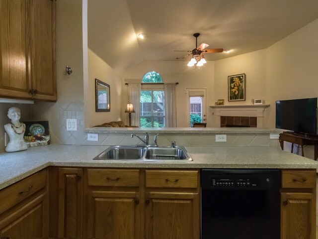 8205 Rayburn Ln, Mckinney, TX 75072 - kitchen featuring black dishwasher, a sink, open floor plan, decorative backsplash, and ceiling fan