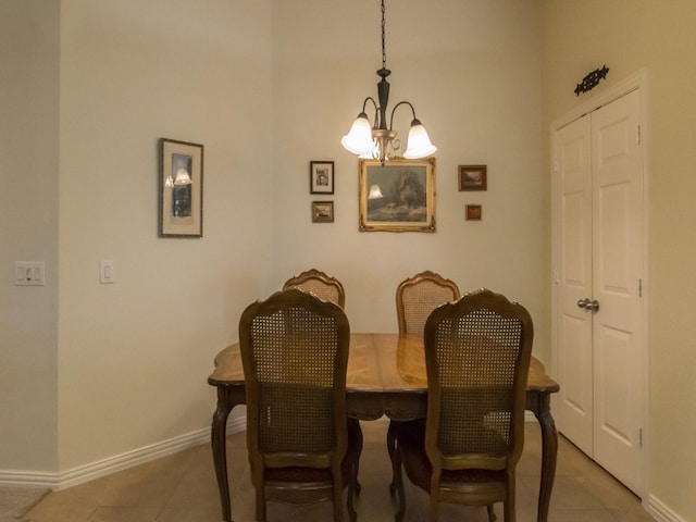 8205 Rayburn Ln, Mckinney, TX 75072 - dining space with a chandelier, baseboards, light tile patterned floors, and a high ceiling