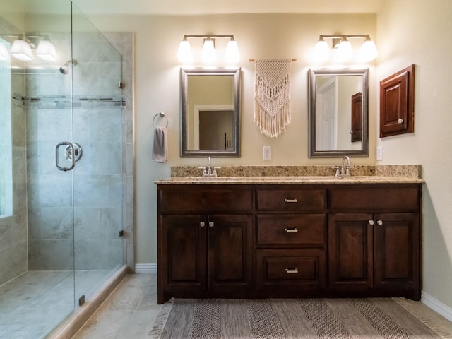 8205 Rayburn Ln, Mckinney, TX 75072 - full bath featuring double vanity, a stall shower, and baseboards