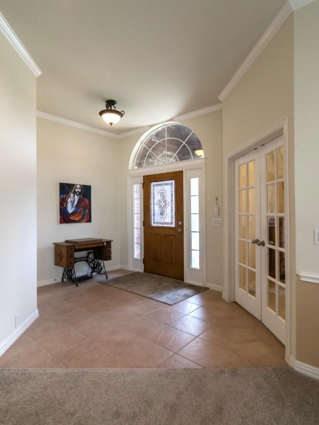 8205 Rayburn Ln, Mckinney, TX 75072 - tiled entryway with french doors, crown molding, baseboards, and carpet flooring