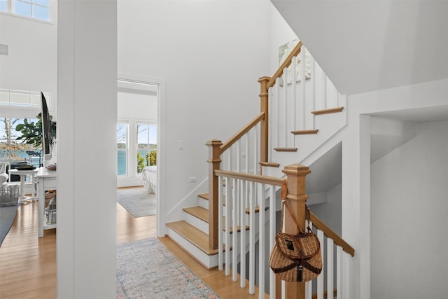 13390 Waterside Dr, Malakoff, TX 75148 - stairway with a high ceiling and wood finished floors